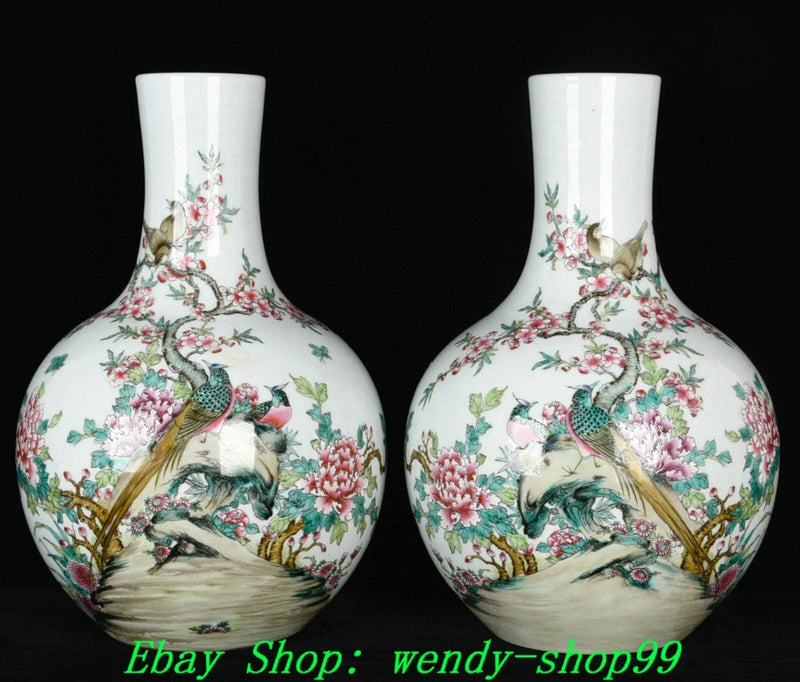 Pair of porcelain vases with peony, birds, and floral decoration on a white base