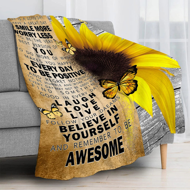 Sunflower throw blanket with yellow fabric, butterflies, and inspirational quote text