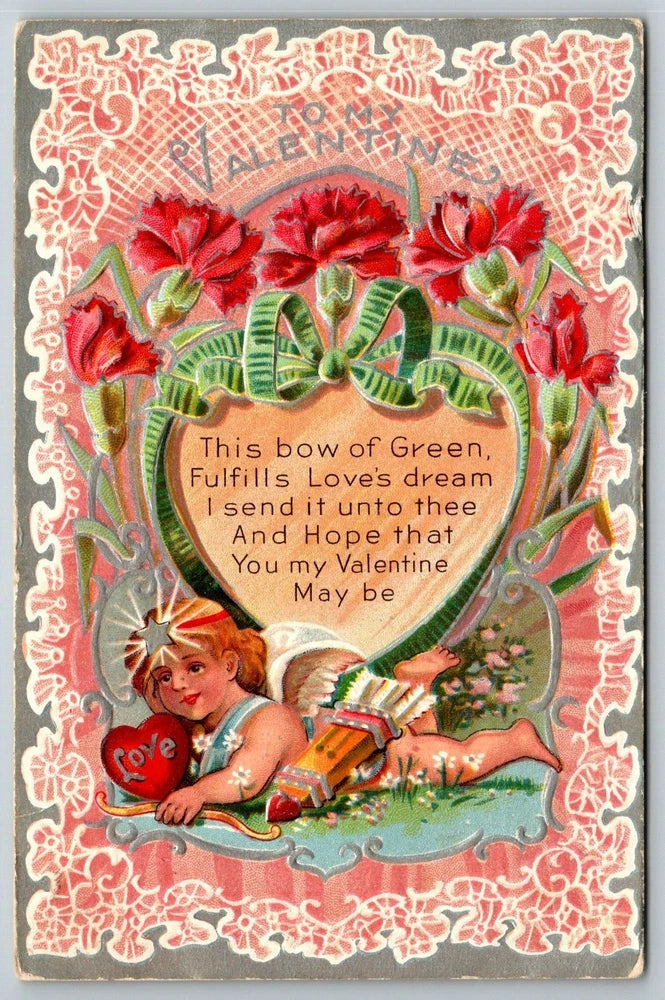 Antique Valentine postcard with embossed border, red carnations, green bow, cherub holding flowers