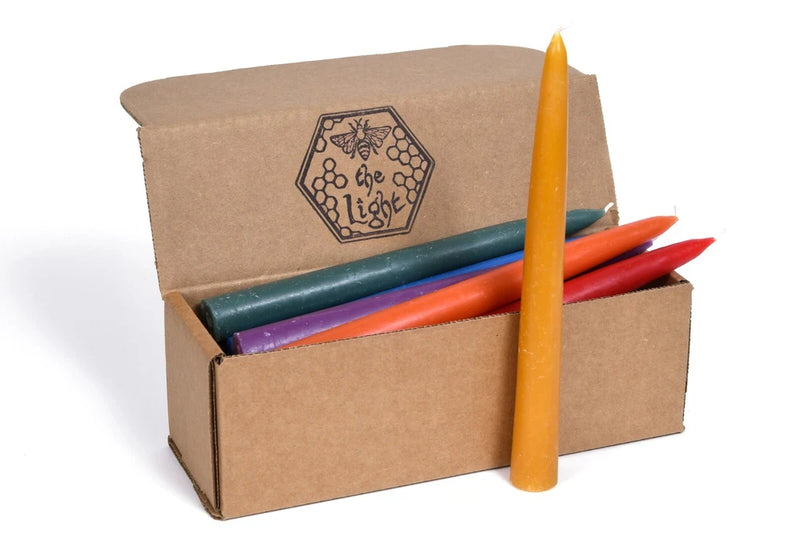 Unscented dipped taper candle bouquet with orange, teal, red, and blue candles in kraft box