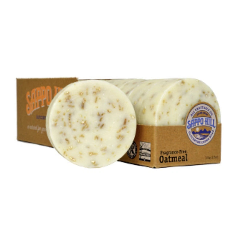 Oatmeal bar soap, fragrance-free, light cream with oat specks; shown with cardboard box.