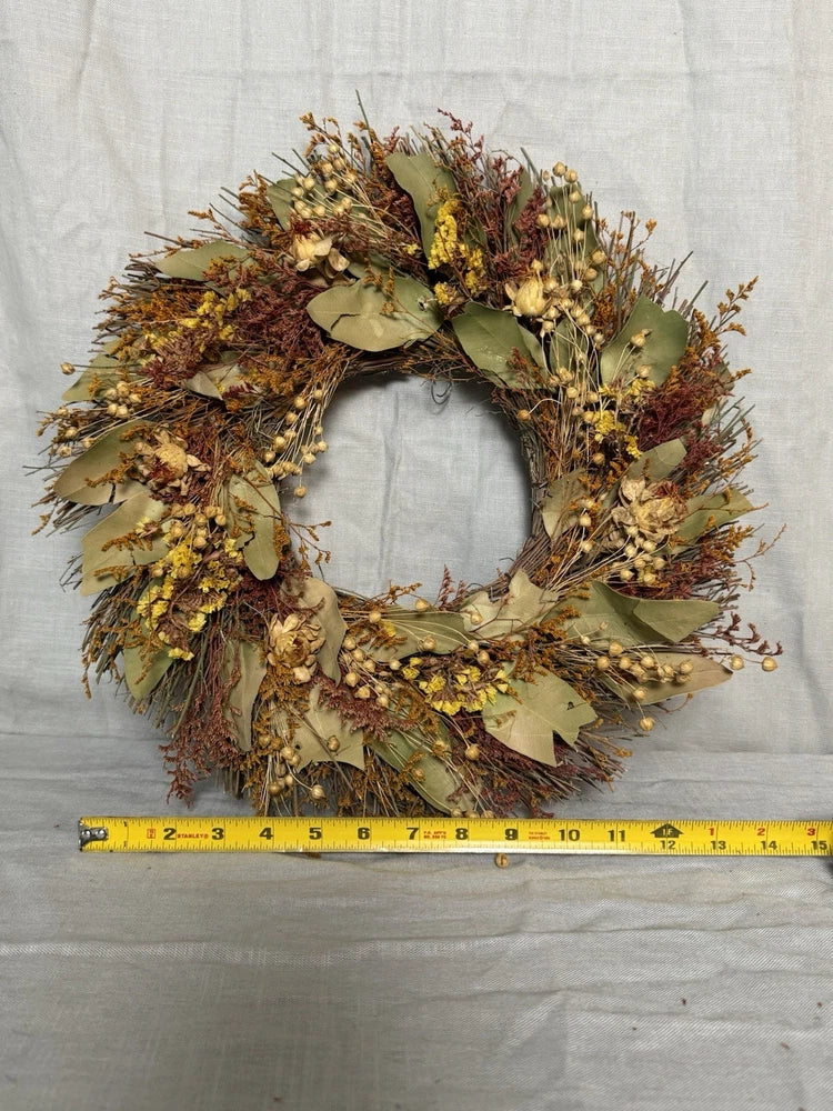 Dried flower door wreath with green and yellow floral ring
