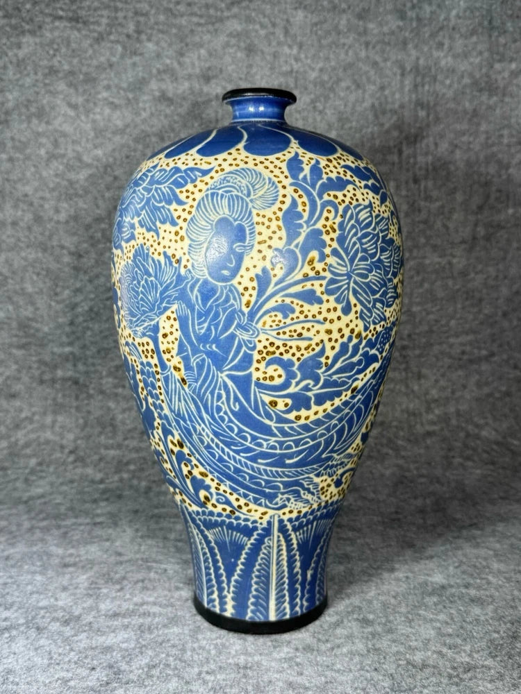Blue and white porcelain vase with ornate peony flower pattern and dark blue rim