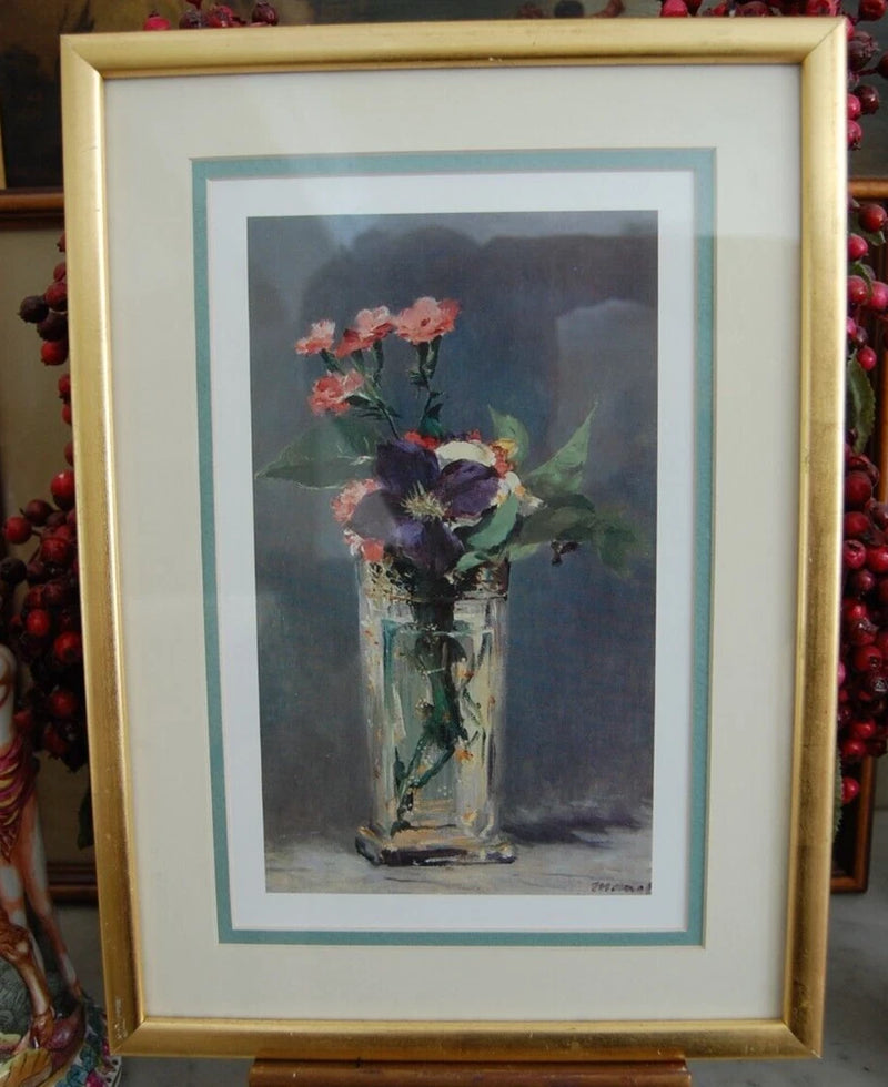 Framed matted art print with crystal vase and colorful flowers