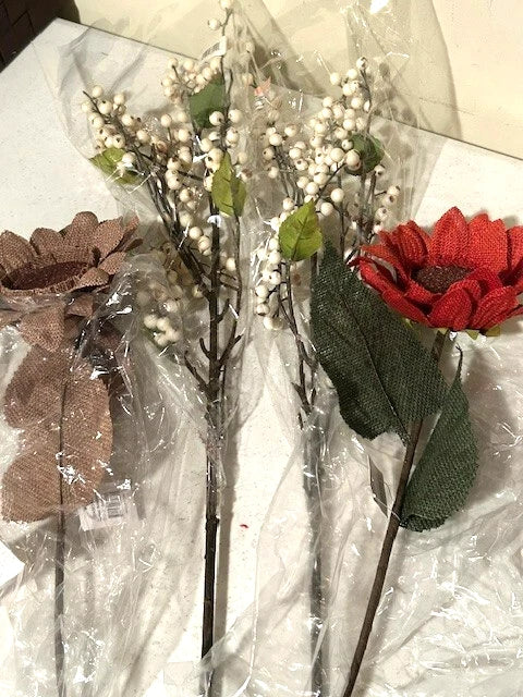 Decorative stems with white berry clusters, green leaves, red and brown fabric flowers