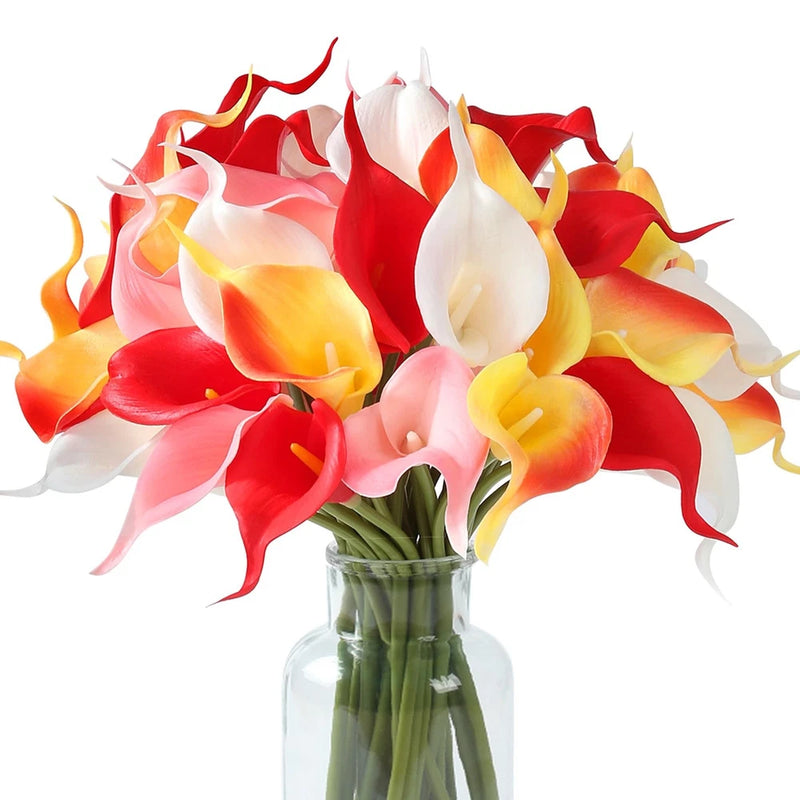 Artificial calla lily bouquet with mixed red, white, yellow blooms in a clear glass vase