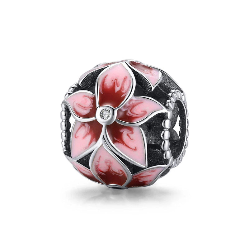 Sterling silver floral charm with pink lily enamel petals and clear crystal center