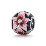 Sterling silver floral charm with pink lily enamel petals and clear crystal center