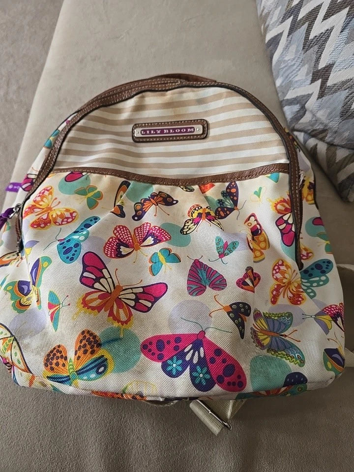 LILY BLOOM multicolor butterfly print backpack with striped top panel and brown trim