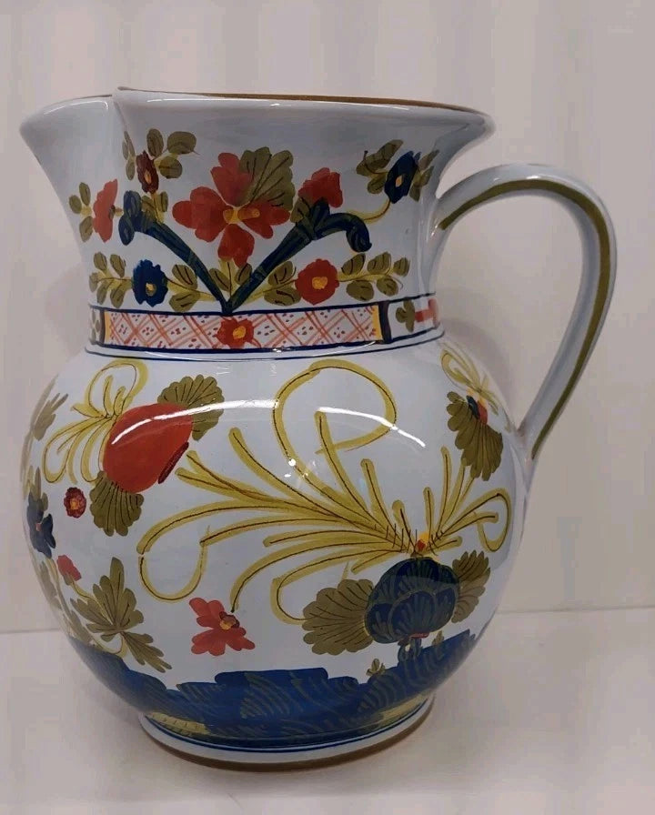 Hand-painted ceramic pottery pitcher jug with floral and blue leaf pattern, round handle