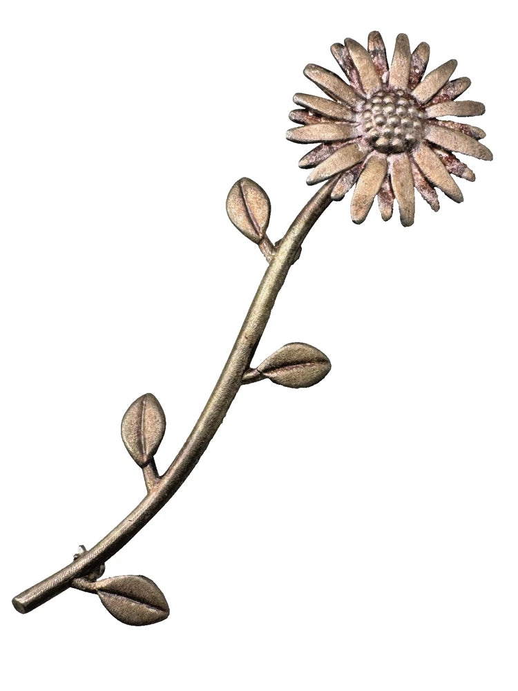 Silver-tone sunflower brooch pin with long stem and leafy details