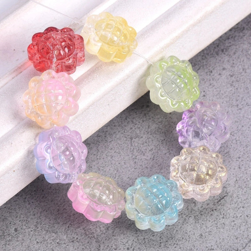 Set of colorful sunflower-shaped glass lampwork beads, translucent pink yellow green purple blue