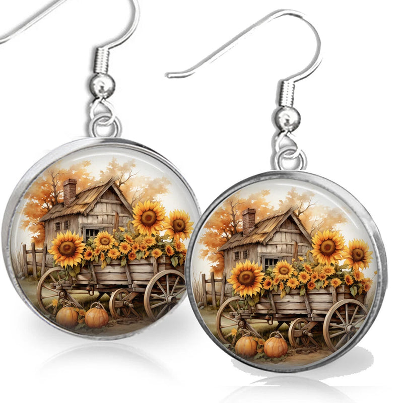 Sunflower cart dangle earrings with round farm scene charms and hook backs