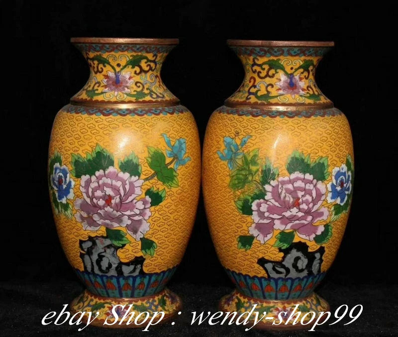 Pair of cloisonne enamel vases with peony flowers on a yellow ground and ornate blue base