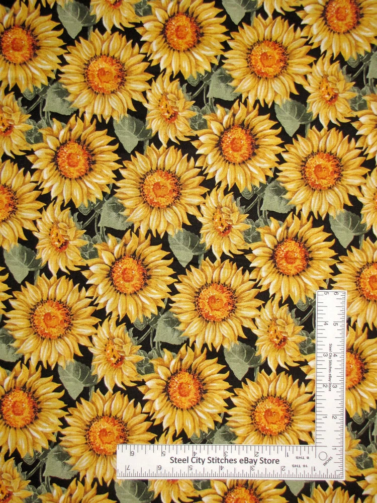 Sunflower floral cotton fabric: yellow blooms on dark background with green leaves