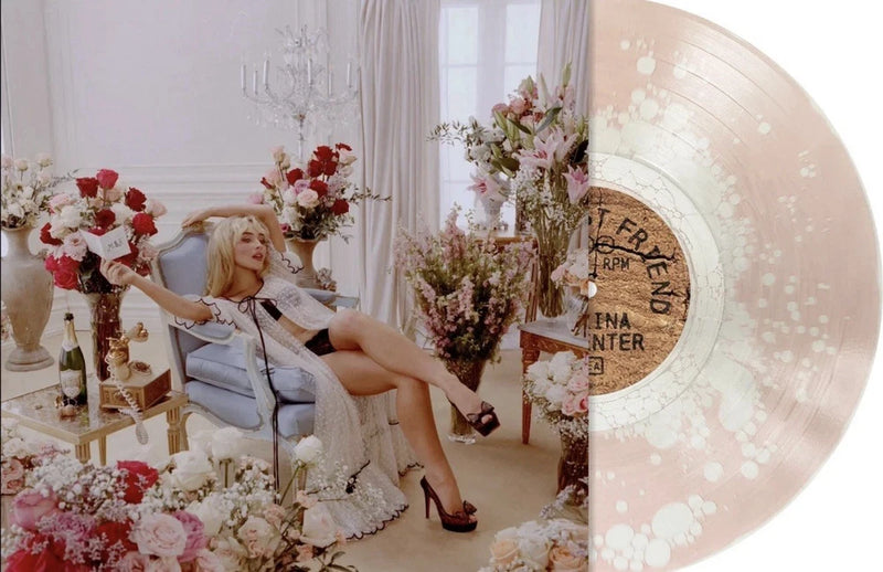 Champagne-pink vinyl record with floral artwork and rose design on the label