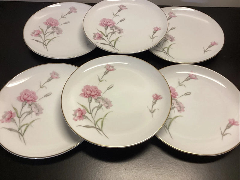 Porcelain dessert plates set with pink carnation floral design and gold rim