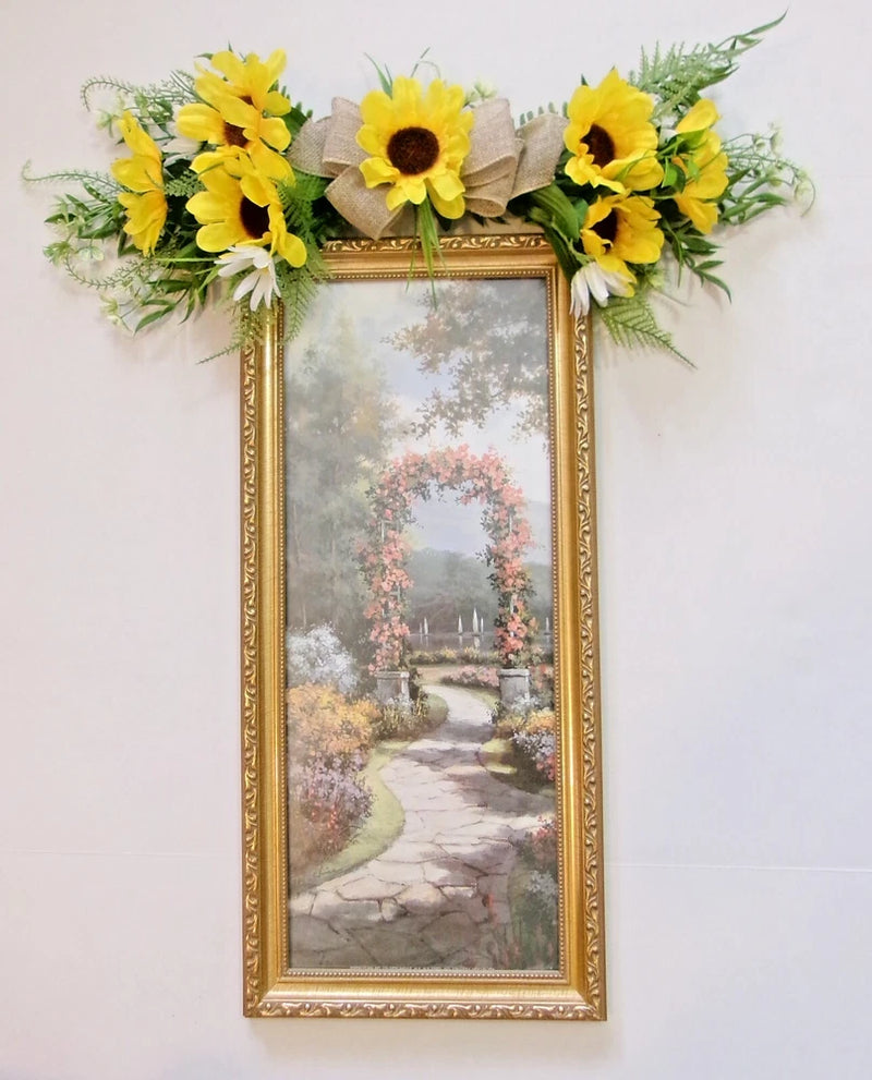 Handcrafted sunflower wall hanging decor with gold-framed picture and leafy sunflower swag