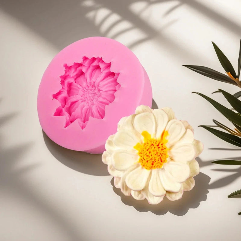 Pink silicone flower mold with scalloped daisy-shaped cavity