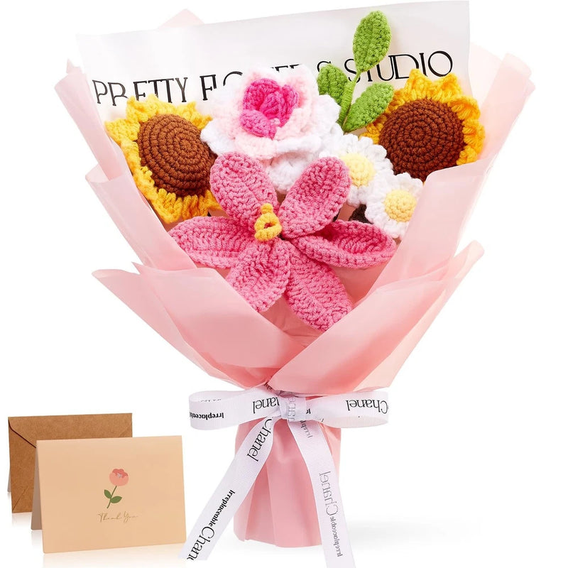 Crochet flower bouquet with pink and white blooms, green leaves, wrapped in pink tissue