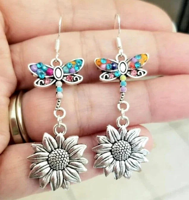 Silver sunflower drop earrings with colorful butterfly-like accents and dangling chain