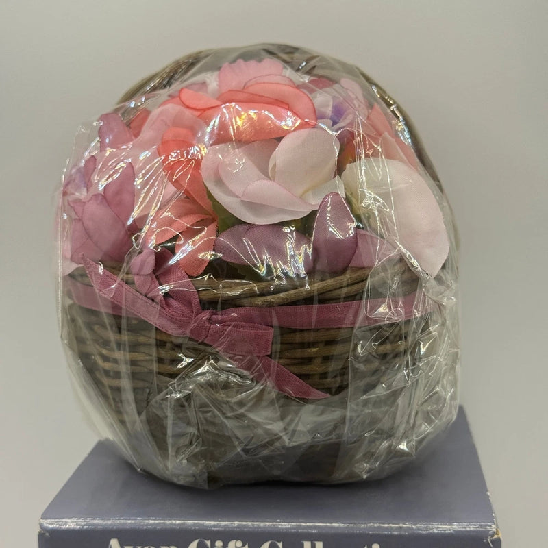 Floral pomander gift basket with faux peonies, wrapped in clear plastic