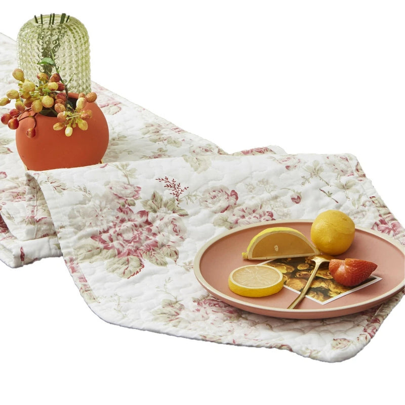 Quilted cotton dining table runner with white base and pink rose floral print