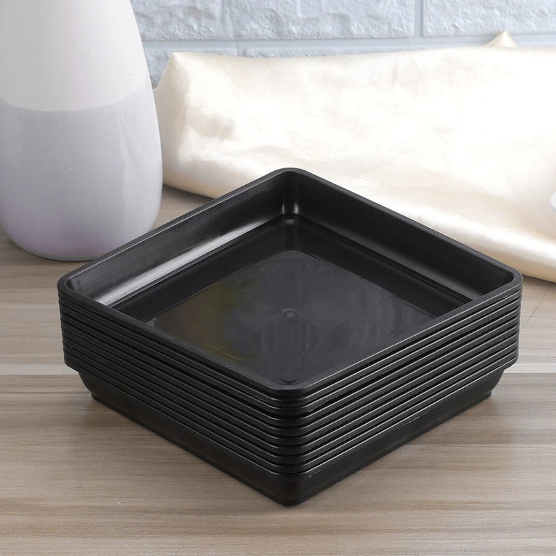 Black square plant drip tray with raised ridged sides and shallow basin