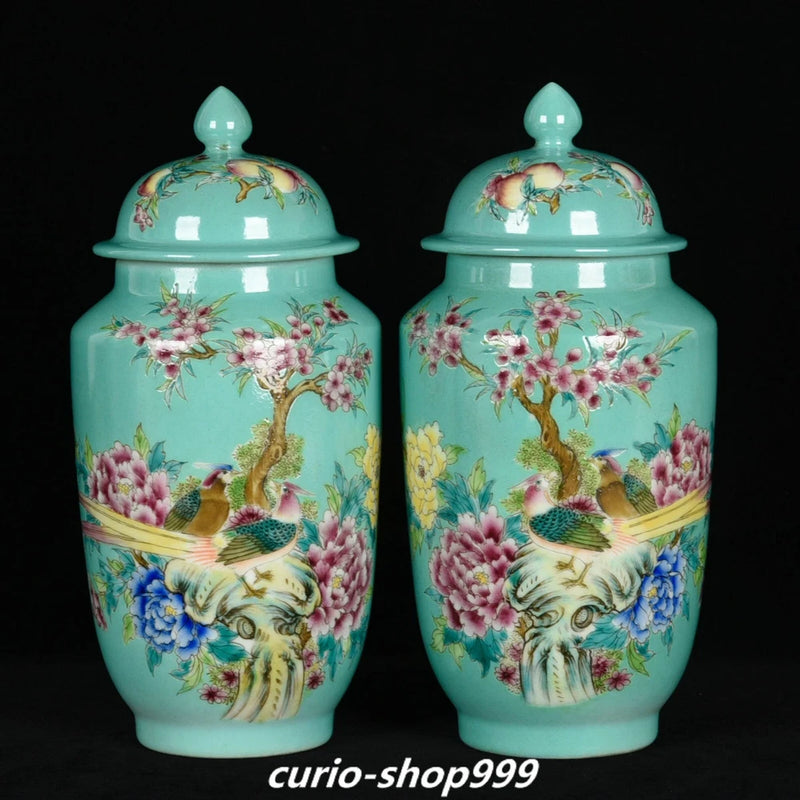 Pair of turquoise porcelain lidded jars with peony flowers and bird-and-branch scenes