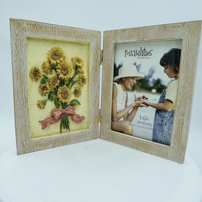 Connoisseur 4x6 picture frame open, sunflower bouquet art on left, portrait on right