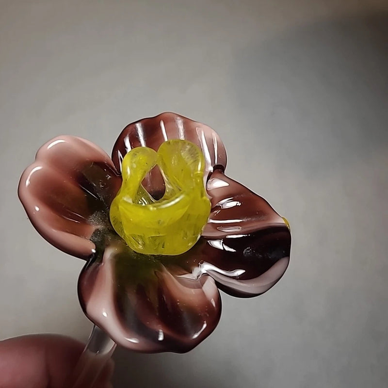Blown glass tiger lily flower with mauve-purple petals and yellow center