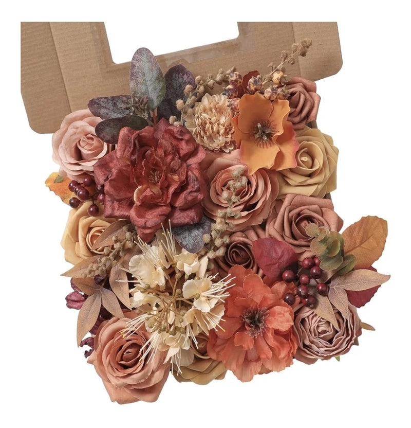 Artificial flower box arrangement with burnt orange and pink faux blooms, leaves, and stems