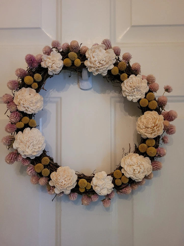 12-inch grapevine dried flower wreath with cream and dusty-pink blooms and seed pods