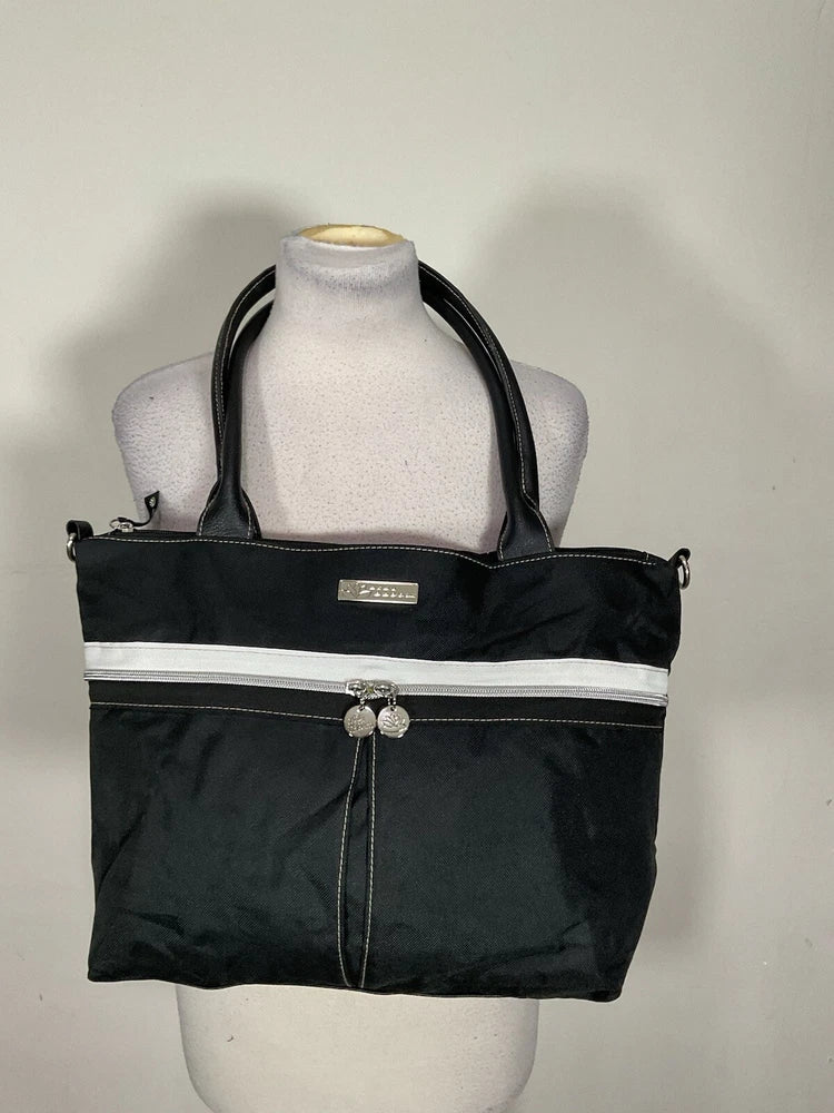 Women’s black handbag tote with top zip, double handles, front logo pocket and flower clasp