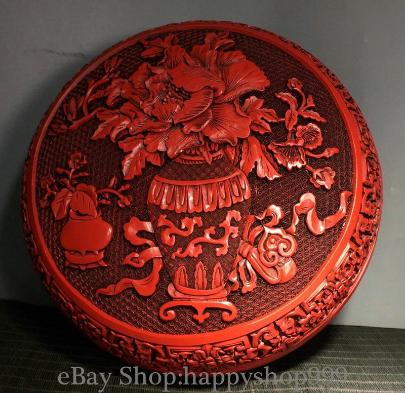 Round red lacquer jewelry box lid with peony floral and ornate carved motifs