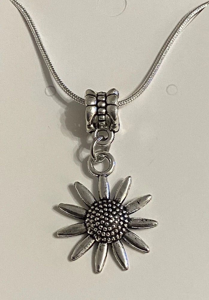 Sterling silver sunflower pendant necklace with textured chain and small sun charm