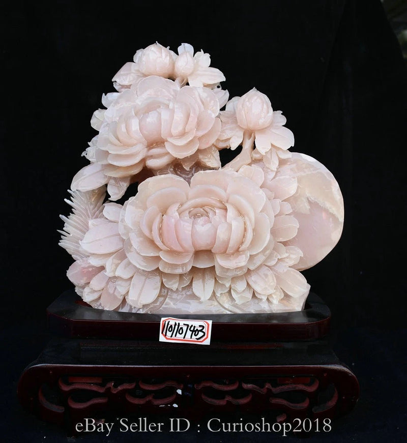 Pink peony jade carving sculpture on dark wooden base, layered petals