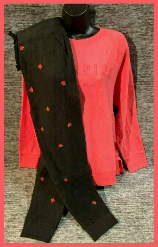 Red long-sleeve pullover with black rose-print leggings