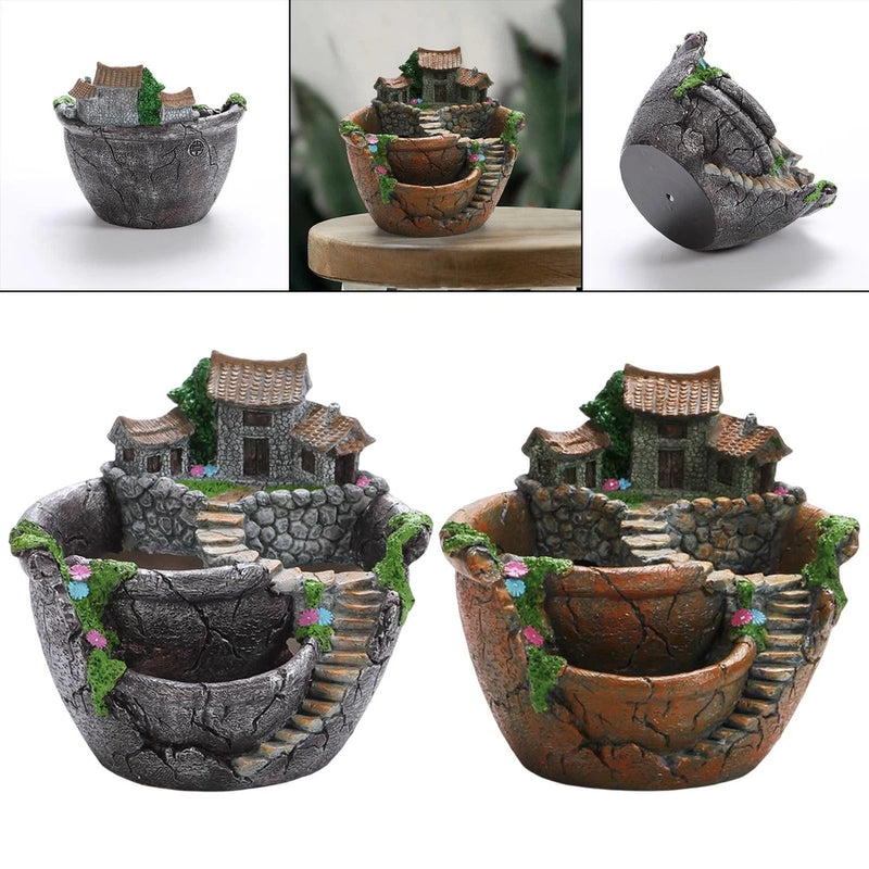 Fairy garden decorative pot with stacked terraced stone, mini houses, and greenery