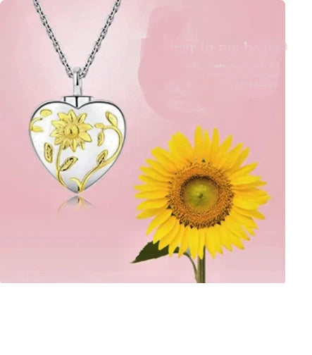 Sterling silver heart pendant necklace with sunflower accents on a silver chain