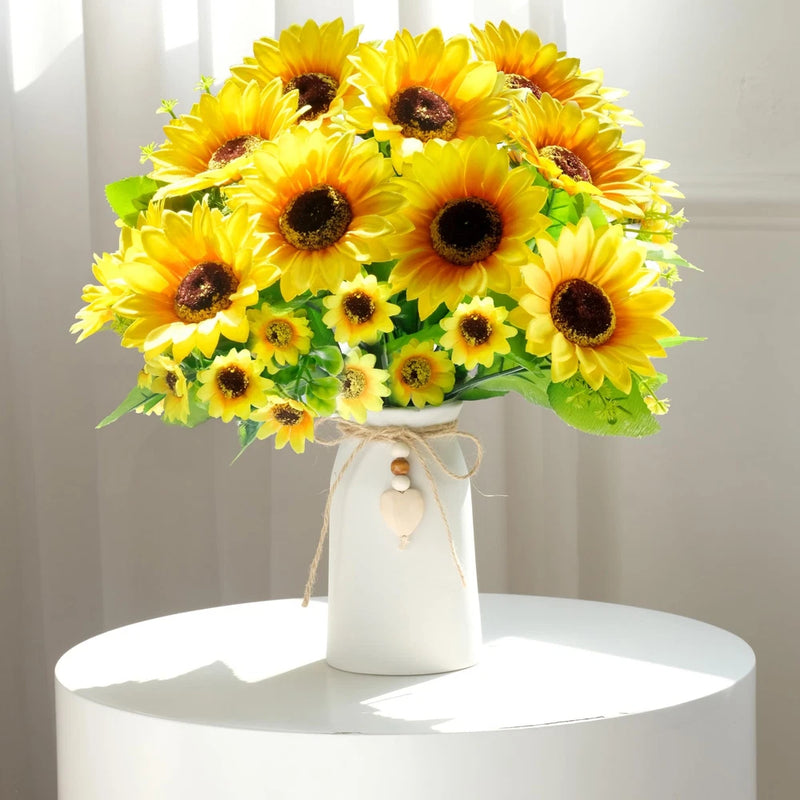 Artificial sunflower arrangement with yellow blooms in a cream vase