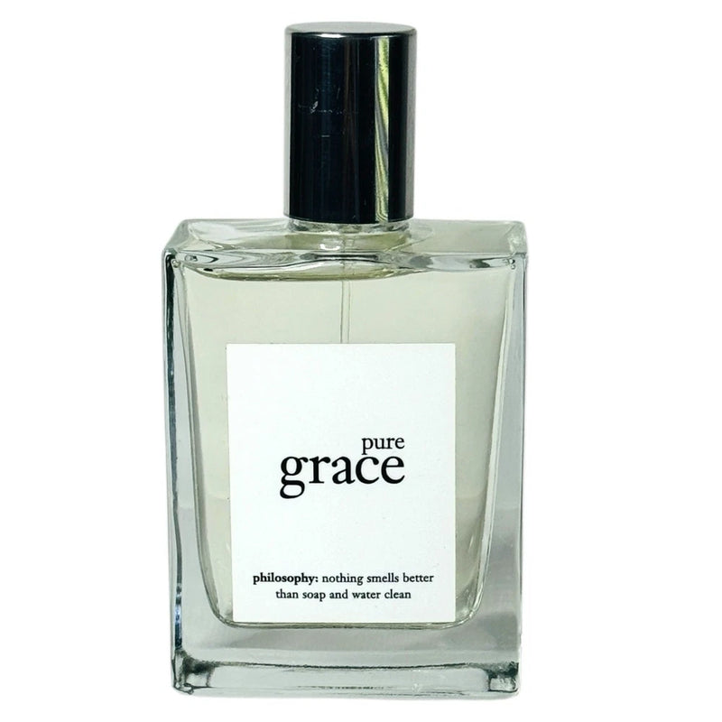 Pure Grace eau de toilette spray bottle with black cap and clear glass