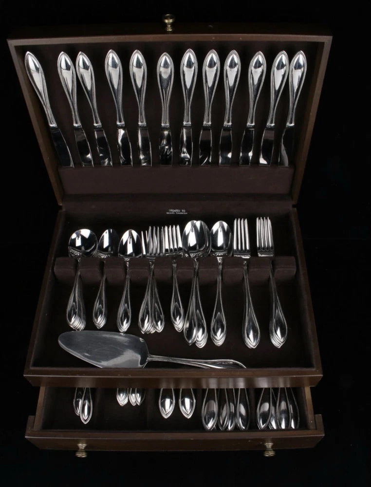 Silver flatware set in wooden storage box, with forks, spoons, and teaspoons