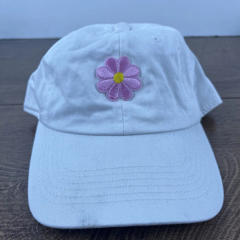 Light blue sun hat with purple-pink flower applique on front