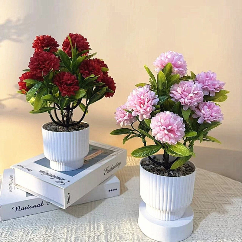 Artificial chrysanthemum flower arrangement set with red and pink blooms in white pots