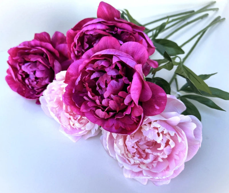 Faux silk peony flower stem with fuchsia and light pink blossoms and green leaves