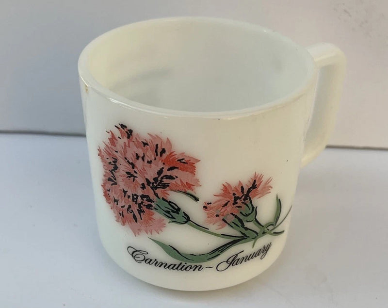 Milk glass cup with red carnation print, handle, 'Carnation—January' text