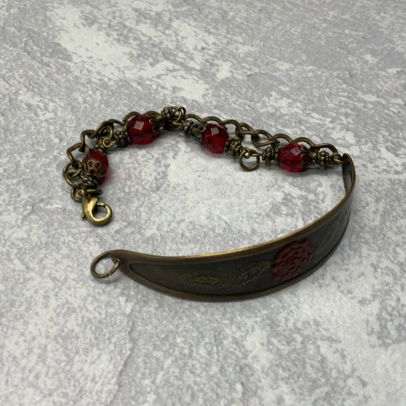 Bronze brass cuff bracelet with engraved red carnation and red bead chain
