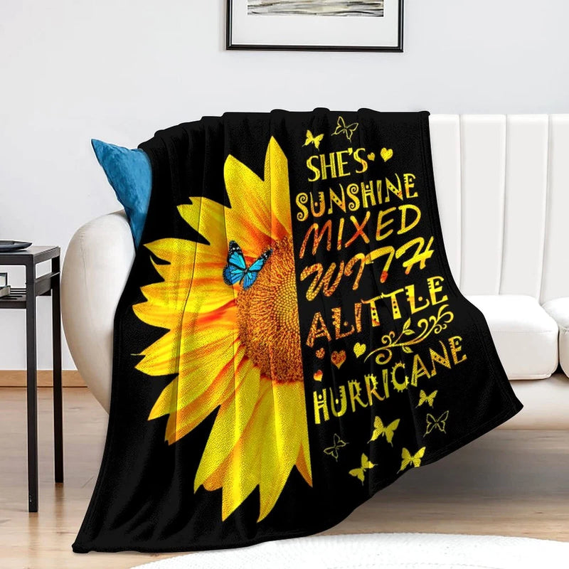 Sunflower throw blanket, black with large yellow sunflower and butterflies, printed text.