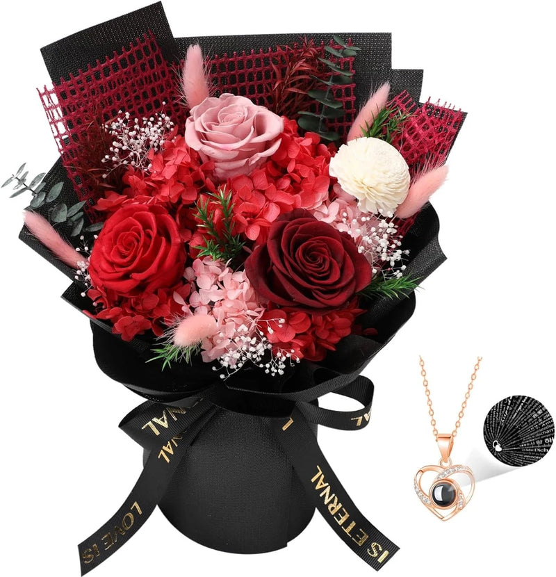 Red and pink preserved rose bouquet with black wrap and heart necklace pendant